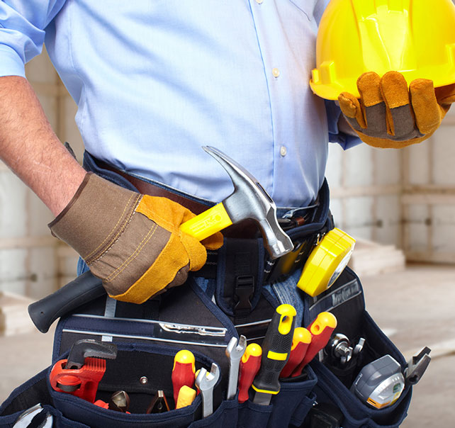 Contractor with tool belt and hard hat